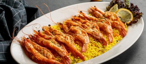 9 7 Queen Prawns cooked in our signature Kashmiri Sauce, served with Jimmy s Rice 7 قطع ربيان كوين من الحجم الكبير