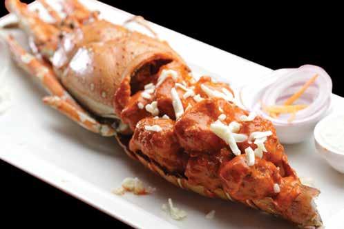 Fresh Crab Cooked With Authentic Indian Onion & Tomato Based Gravy & Spices 93 PRAWN KOLLIWADA FRY 49 Prawn Marinated With Ginger, Garlic, Lemon Juice, Chilly Paste, & Spices Deep Fried & Served With