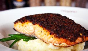 أطباق متخصصة من الشيف Herb Crusted Salmon Fillet.