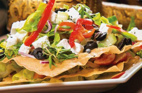 00 Layer of thin crust bread topped with feta cheese, fresh gardens vegetables, walnuts, black olives & black/white sesame