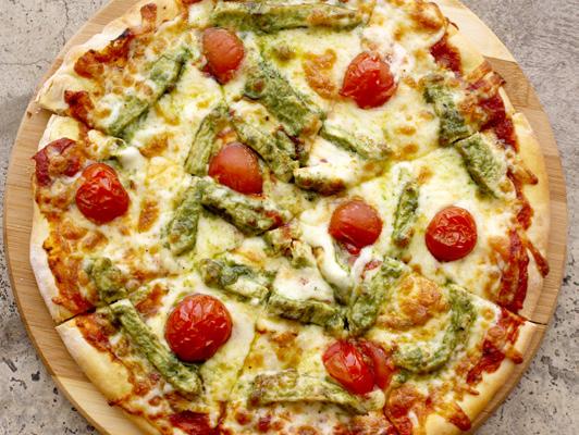 PIZZA بيتزا Pesto chicken pizza, ketchup signature sauce, home made pesto, grilled chicken breast, mozzarella and roasted cherry