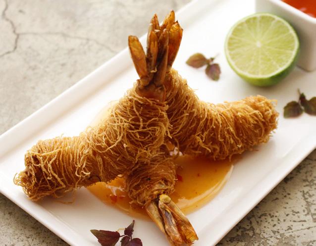 sweet chili sauce SAR 68 337 Calories شرمب كنافة جمبري مغطاة بلكنافة و المقلية بعناية تقدم مع اليمون و الصوص الحلو الحار س.