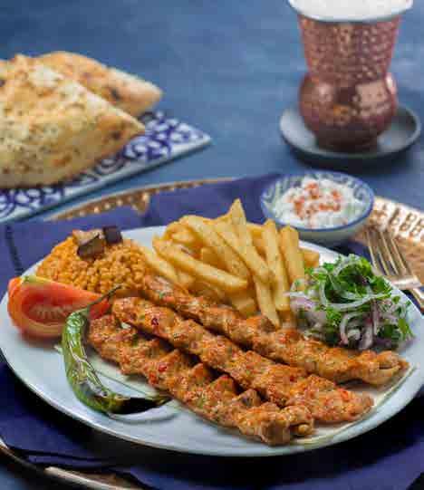 humus, tomato, pickles, parsley and onion stuffed in traditional Turkish bread, drizzled with tahina sauce and served with seasoned French fries 1154 Calories شاورما اللحم** 56 شرائح الشاورما من