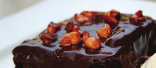 Desserts الحلويات Chocolate Fudge Cake.. 24 Moist chocolate cake topped with fudge sauce and caramelized almonds Tiramisu.